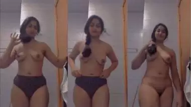 An Indian nude girl strips and shoots MMS